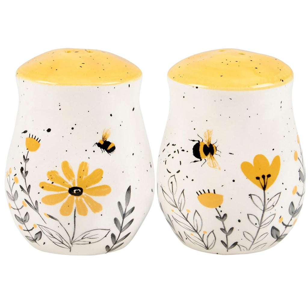 Primitives by Kathy Salt & Pepper Set - features bees buzzing over flowers with yellow accents. Shakers include unique openings to tell them apart, with plastic stoppers for easy refilling & cleaning