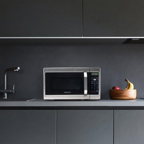 Farberware 0.7 Cu. Ft. Countertop Microwave Oven – 700 Watts Power, Auto Cook Settings, Defrost, Easy Clean and Child Safety Lock - Stainless
