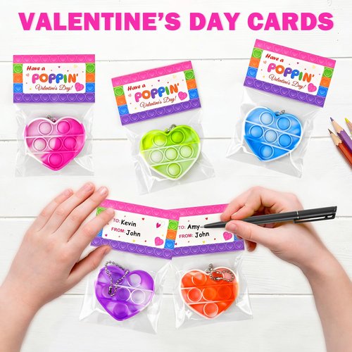 Wondrus Holiday Gifts Exchange Cards for Classroom Kids 28 Pcs, Heart Pop Fidget Toys with Keychains for Preschool Toddlers,Non Candy Party Favors Goodie Bag Stuffers for Kindergarten Boys Girls