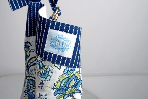 Mary DiSomma Designer Luxe Apron | Signature Floral Print Design, Navy Blue Stripe Weave, Adjustable Waist Strap, Divided Front Pocket and Adjustable Neck Strap with Gold Double Ring Clasp