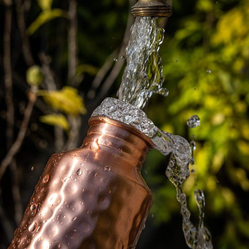 Copper Water Bottle - 34oz Hammered Vintage Modern Design - A Handcrafted Ayurvedic Pure Copper Vessel For Drinking - Drink More Water, Lower Your Sugar Intake And Enjoy The Health Benefits
