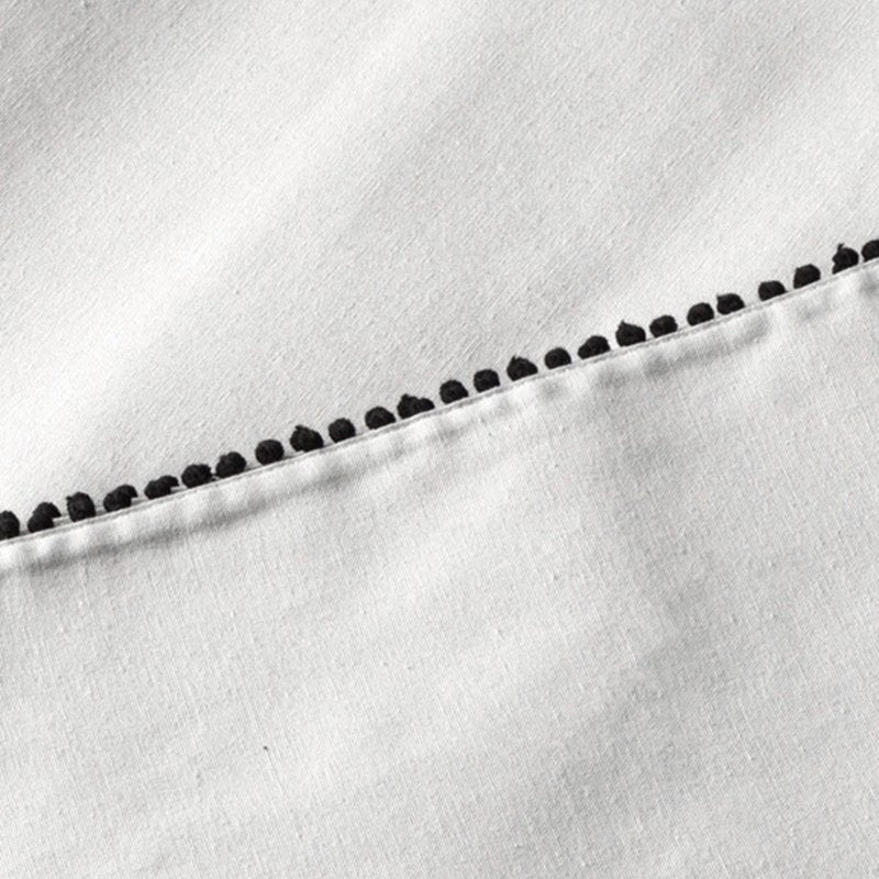 84" Ivory Tablecloth with Black Pom Pom Trim - Single